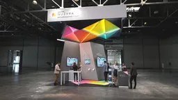 20x20 booth with bold colors and dynamic screens